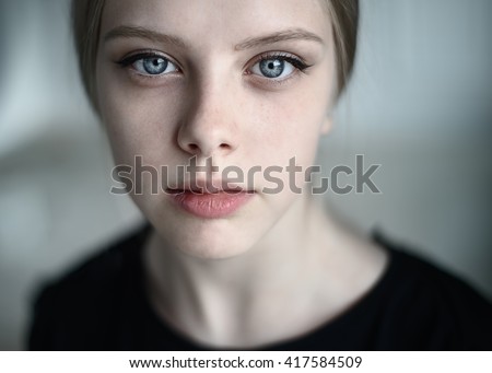 Natural portrait of a beautiful young girl close-up
