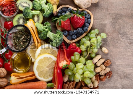 Natural products rich in antioxidants and vitamins. Healthy clean and detox food - vegetables, fruits, nuts, superfoods 