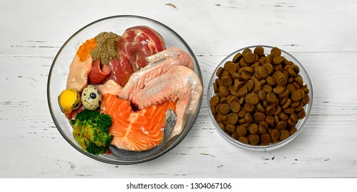 

Natural Raw Dog Food And Dry Dog  Food In Bowls 