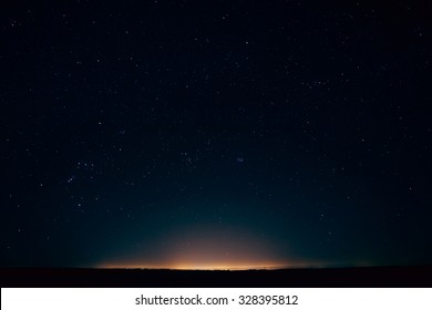 Natural Real Night Sky Stars Background Texture. Sunset, Sunrise Over Field