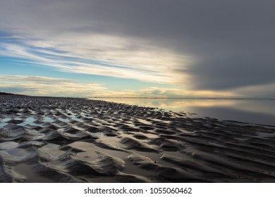 Natural Sand Drawing At A Beautiful Sunset With Clouds At The Beach. Rio Grande, Tierra Del Fuego, Argentina