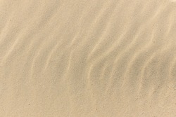 Natural Sand Stone Texture Background. Sand On The Beach As Background. Wavy Sand Background For Summer Designs.