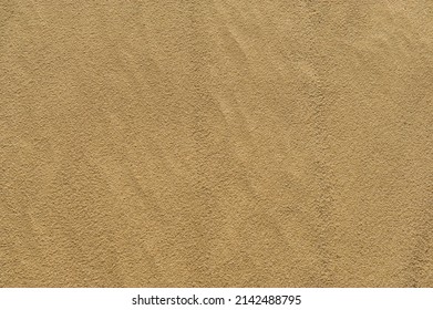 Natural sand surface in the dunes on a sunny day. Spring season, April.