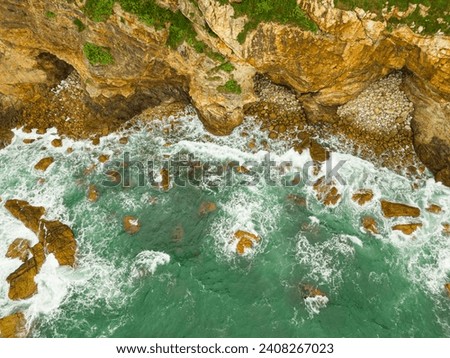 Similar – Aerial Drone View Of Dramatic Ocean Waves Crushing On Rocky Landscape