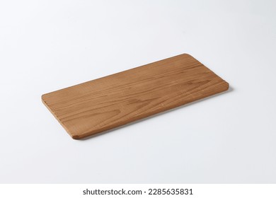 Natural slim wooden rectangle board  on a white background at a high angle
