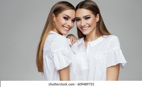 Natural smile of sisters models