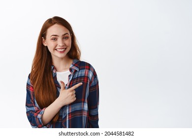 Natural Smiling Teen Girl Student, Red Long Hair And Freckles, Pointing Right And Looking Happy, Showing Logo Or Link, Shopping Promotion, White Background