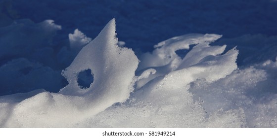 Natural snow sculpture. Snow shaped by wind and weather.