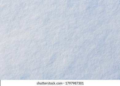 Natural Snow Texture. Smooth Surface Of Clean Fresh Snow. Snowy Ground. Winter Background With Snow Patterns. Perfect For Christmas And New Year Design. Closeup Top View.