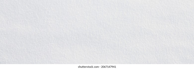 Natural snow texture. Smooth surface of clean fresh snow. Snowy ground. Winter background with snow patterns. Closeup top view. Wide panoramic texture for background and design. - Shutterstock ID 2067147941