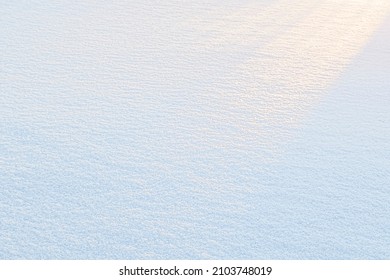 Natural snow texture. Smooth surface of clean fresh snow. Snowy ground. Winter background with snow patterns.  texture for background and design.