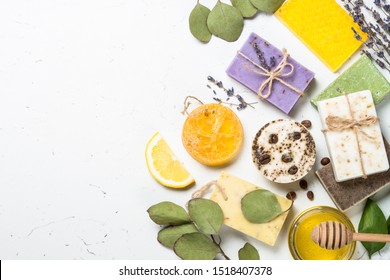 Natural Soap Bars With Ingredients. Aloe, Lavender, Eucalyptus, Olive, Honey, Coffee, Tee Tree Oil And Oat Soaps. Top View With Copy Space.