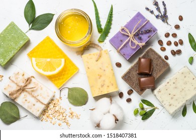 Natural Soap Bars With Ingredients. Aloe, Lavender, Eucalyptus, Olive, Honey, Coffee, Tee Tree Oil And Oat Soaps. Top View.