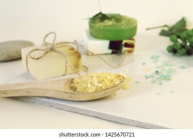 Natural soap, sea salt, grape branch, shells and stones on the table, spa procedures, body care - Shutterstock ID 1425670721