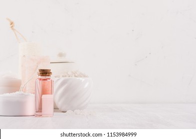 Natural Spa Cosmetics In Ceramics Bowl With Pink Rose Oil, Salt, Soap On White Wood Background, Interior, Border.