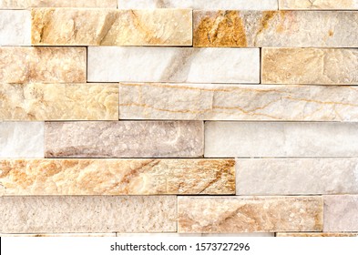 Natural Stone Cladding Mosaic Tile Wall .Old stone facade, seamless pattern . Top view, copy space.