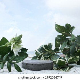 Natural Stone And Concrete Podium On Tropical Beach With Flowers. Empty Showcase For Packaging Product Presentation. Background For Cosmetic Products, Scene With Green Leaves. Mock Up Pedestal.