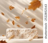 Natural stone podium with falling autumn leaves in front of beige background. Fall season, thanksgiving and seasonal home decor scene. Premium brand product placement showroom stage