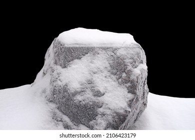 Natural Stone In Snow Isolated On Black Background. High Quality Photo