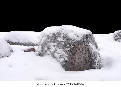 natural stone in snow isolated on black background. High quality photo - Powered by Shutterstock