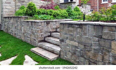 Natural stone steps and retaining wall in the garden. - Shutterstock ID 1942652242