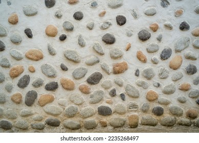 Natural stone wall background. Stone, pebble, brick wall texture. Background for design and decoration. Many uses! - Shutterstock ID 2235268497