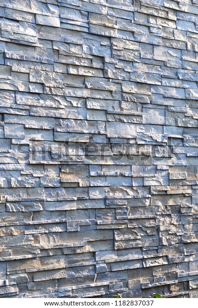 Natural stone wall\
cladding texture\
background