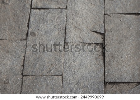 natural stone wall motif on the floor in a vertical direction