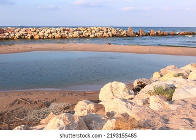 Natural Stony Beach Landscape In Spain With Sand Spit Close Up Photo