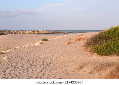 Natural Stony Beach Landscape In Spain With Sand Spit Close Up Photo