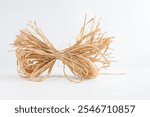 natural straw sheaf decorative bow isolated on a white background