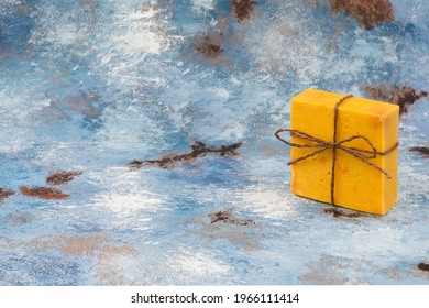 Natural Sulfur Soap On A Blue Tumbled Floor