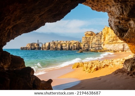 A natural summer beach cave at Praia da Coelha, Algarve, Albufeira. Portugal