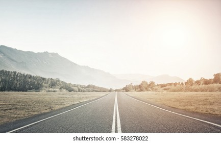 Natural summer landscape with asphalt road to horizon - Powered by Shutterstock