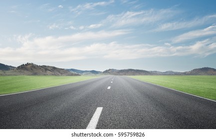 Natural Summer Landscape With Asphalt Road To Horizon