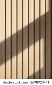 Natural sunlight casting soft diagonal shadow on vertical wooden wall texture. Minimal and warm design background perfect for interior, architecture, or aesthetic concepts.
