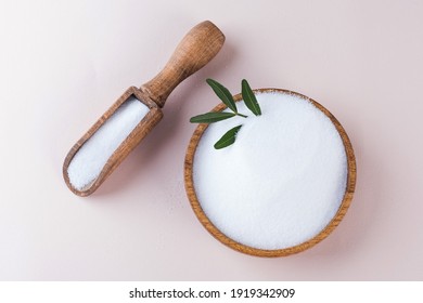 Natural Sweetener In A Wooden Bowl On A Pink Background. Sugar Substitute. Erythritol. 