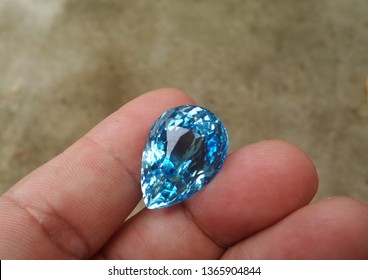 Natural Swiss Blue Topaz Gemstone With Old Cement Floor