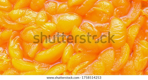 Natural texture of apricot\
jam. Homemade preparations, winter jam. Close-up. Selective\
focus.