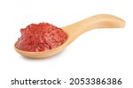 natural tomato paste in wooden spoon isolated on white.
