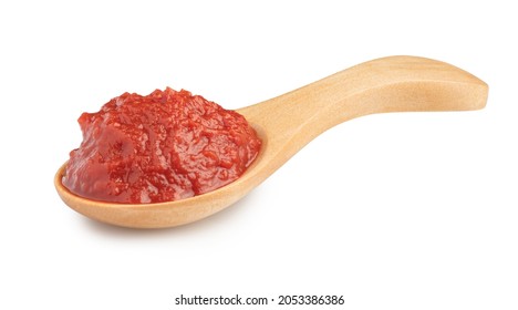 natural tomato paste in wooden spoon isolated on white. - Shutterstock ID 2053386386
