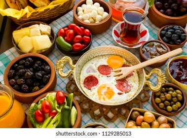 Natural Traditional Turkish Village Breakfast on the wooden table with  copper egg pan,ceramic casserole and bamboo breakfast set. - Powered by Shutterstock