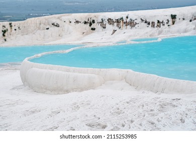 Natural travertine pools and terraces in Pamukkale. Cotton castle in southwestern Turkey. UNESCO World Heritage,  Denizli, Pamukkale geothermal springs, travertine terraces, ancient city of Hierapolis