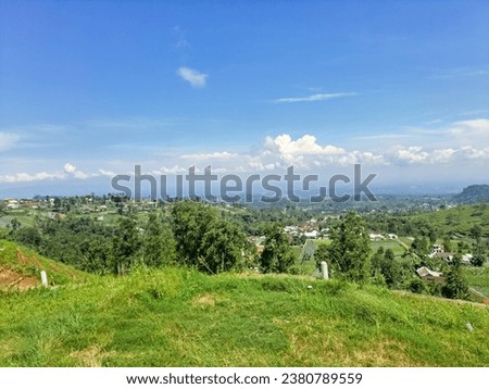 Natural View Of The Hills With Cloudy Blue Sky And Green Plants