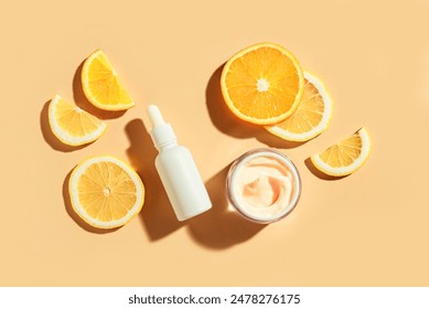 Natural vitamin C serum and face cream, skin care, essential oil products. Cosmetic products and fresh juicy lemon and orange fruit slice, trendy layout. - Powered by Shutterstock