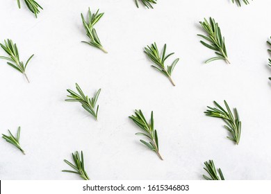 Natural Wallpaper With Aromatic Rosemary Twigs. Rosemary Pattern On White Marble Background. Flat Lay Overhead Composition.