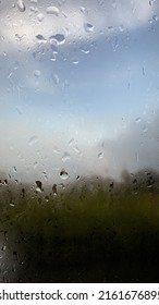 Natural water drop on glass. Rain drops on window. Rainy day