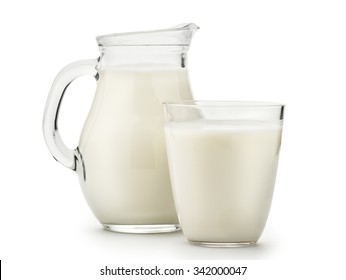 Natural whole milk in a jug and a glass isolated on a white background closeup