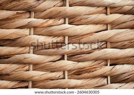 Natural wicker texture. Wicker pattern on the basket. Wicker basket background. Wicker background.