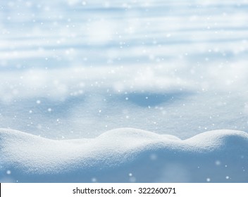 Natural winter background with snow drifts and falling snow - Powered by Shutterstock